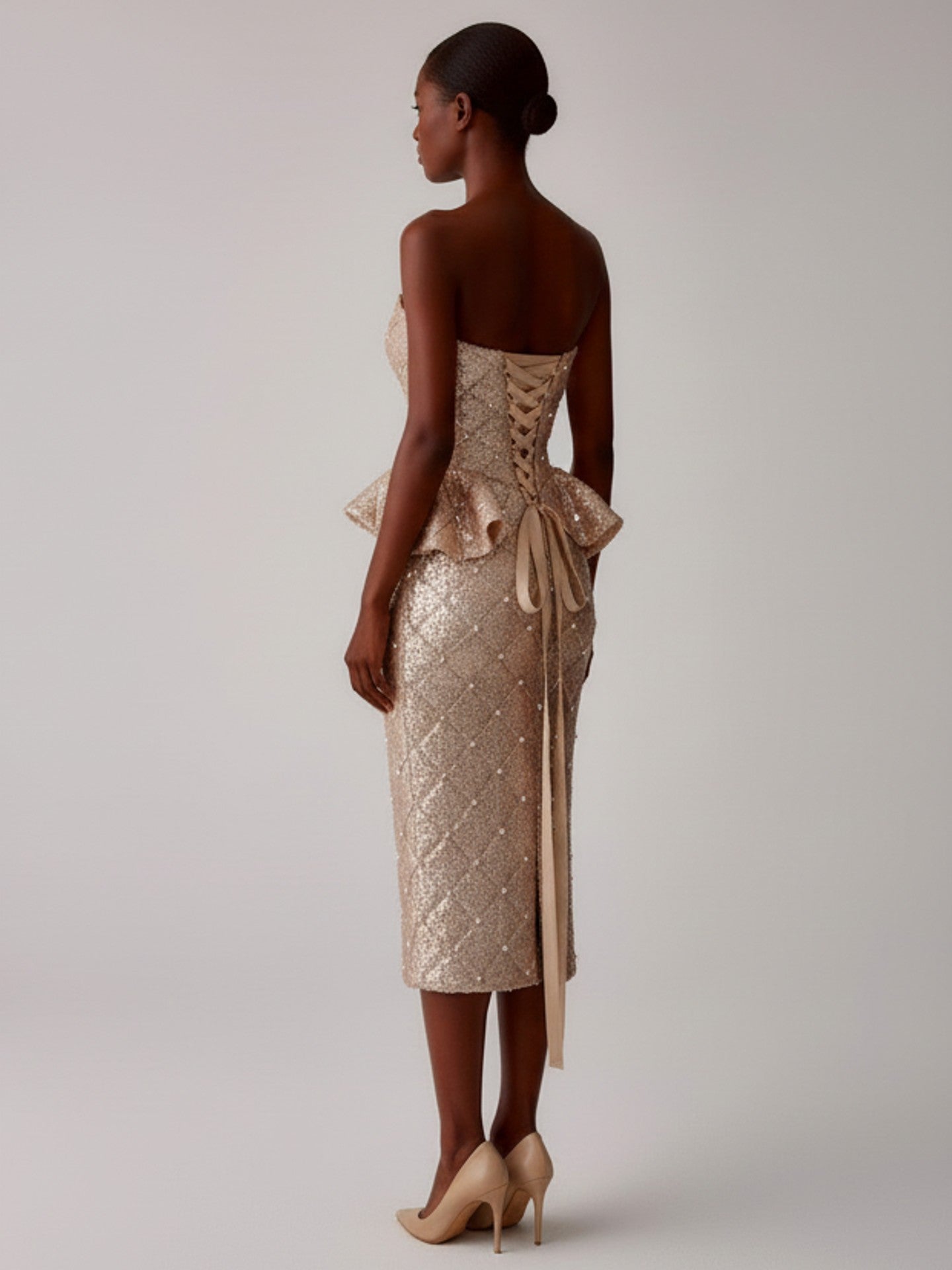 Back view of model wearing sequin midi pencil skirt luxury eveningwear NYC handmade
