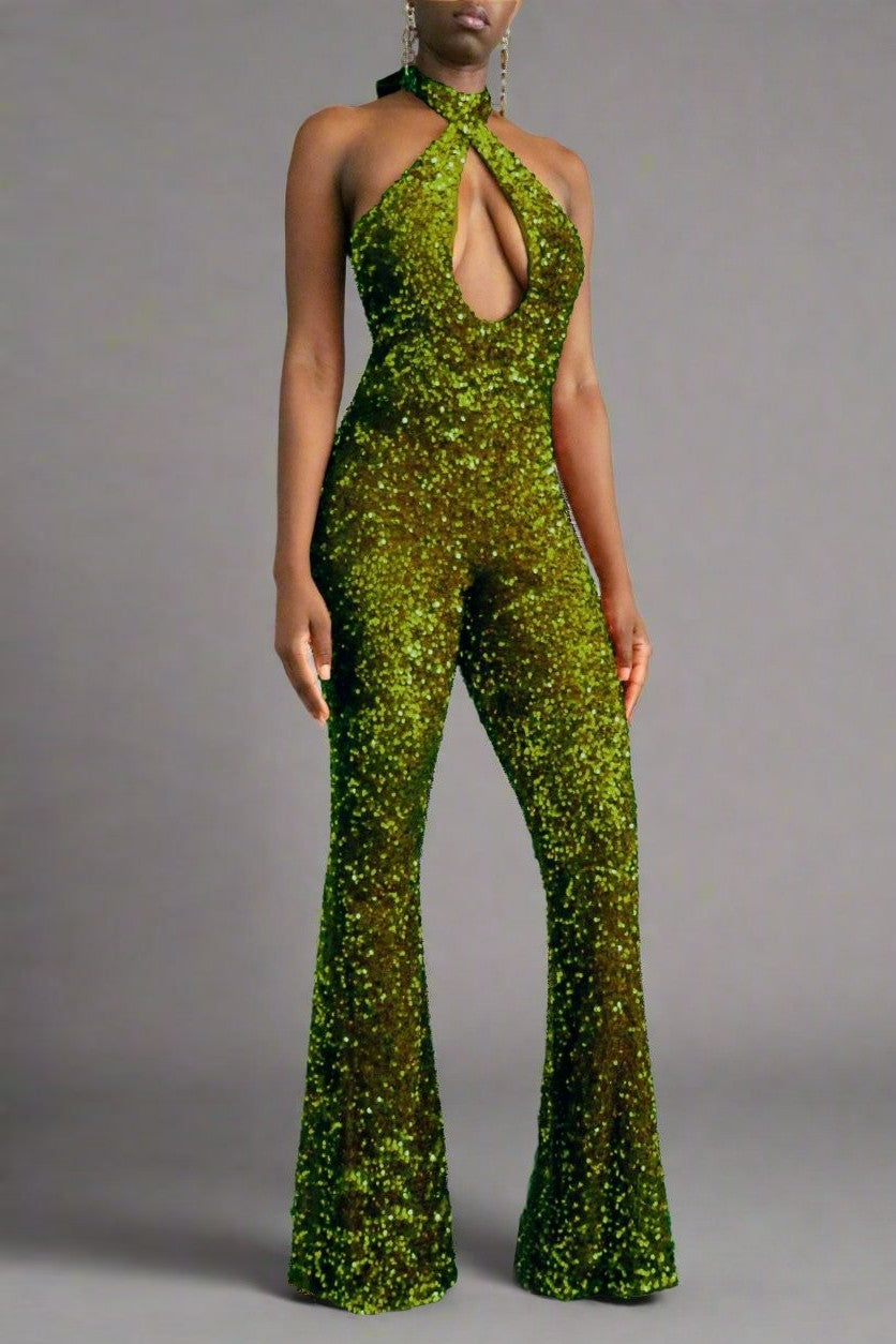 The model is wearing the front view of an olive green sequin halter backless flare leg jumpsuit